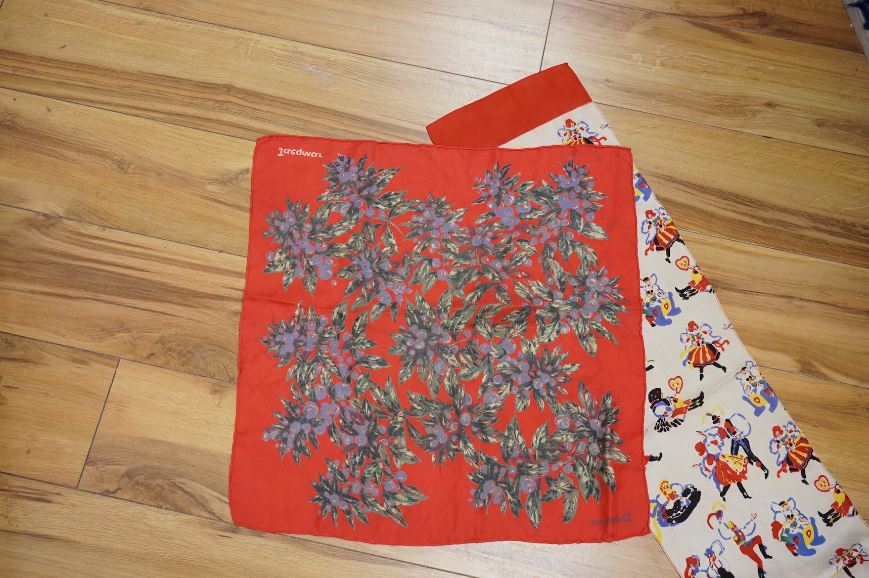 A novelty cartoon style Jacqmar silk scarf, two others and two unnamed scarves